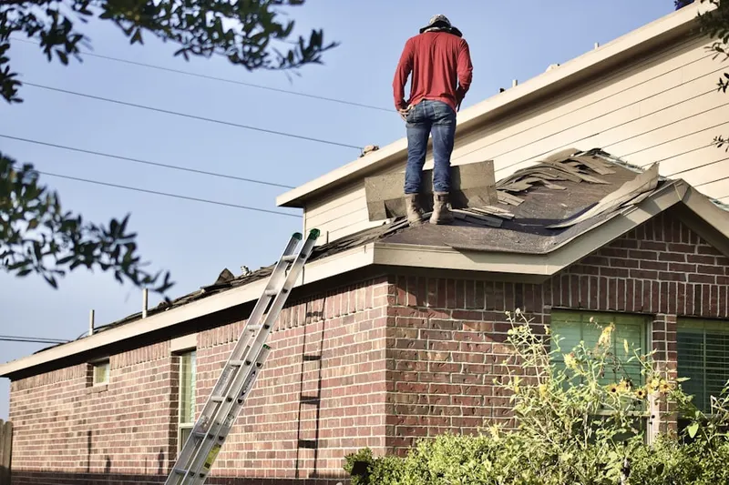 Professional roofer working on a residential roof in Wrightview